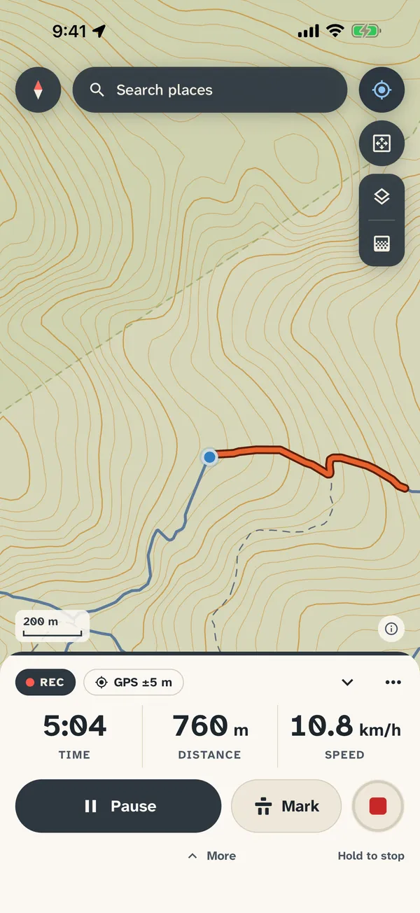 Recording a trail run: the route drawn in orange behind the position dot, and a panel showing 5:04 time, 760 m distance and 10.8 km/h, with Pause and Mark buttons
